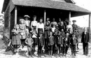 Image of students in front of school