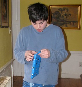 Clay opening a present