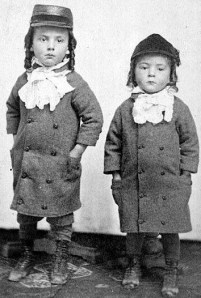 Two brothers standing next to each other